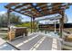The private dock features a boat lift and convenient sink area, set against a backdrop of lush greenery and tranquil waters at 14409 Birch St, Hudson, FL 34667