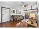 Comfortable living room with hardwood floors, cozy furniture, and natural light at 14409 Birch St, Hudson, FL 34667