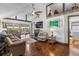 Spacious living room featuring hardwood floors, high ceilings, and comfortable seating areas at 14409 Birch St, Hudson, FL 34667