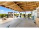 The covered patio area offers waterfront views and an outdoor dining set, perfect for enjoying scenic meals and relaxation at 14409 Birch St, Hudson, FL 34667