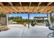 The covered patio has relaxing swing chairs and picturesque waterfront views, creating an ideal outdoor entertaining space at 14409 Birch St, Hudson, FL 34667