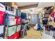 A bright storage room with ample shelving, filled with organized containers, offering practical and efficient storage solutions at 14409 Birch St, Hudson, FL 34667