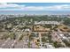 Aerial view of neighborhood and community with ocean view and surrounding trees and landscaping at 14564 110Th Ter, Largo, FL 33774