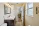 Bright bathroom with updated sink and vanity, linen closet and tile floors at 14564 110Th Ter, Largo, FL 33774
