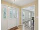 Welcoming home entryway featuring tile floors and a decorative front door at 14564 110Th Ter, Largo, FL 33774