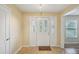Bright home entryway featuring tile floors and a decorative front door at 14564 110Th Ter, Largo, FL 33774