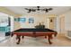 Billiards room complete with a pool table and decorative accents, offering a fun entertainment space at 14564 110Th Ter, Largo, FL 33774