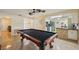 Spacious game room featuring a pool table, with views into the kitchen and other living spaces at 14564 110Th Ter, Largo, FL 33774