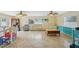 Open concept living room with tile floors, ceiling fans and lots of natural light at 14564 110Th Ter, Largo, FL 33774