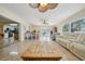 Bright and open living room boasts tile floors, ceiling fans and comfortable seating at 14564 110Th Ter, Largo, FL 33774