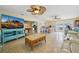Open concept living room with tile floors seamlessly connects to the kitchen and outdoor area at 14564 110Th Ter, Largo, FL 33774