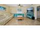 Spacious living room featuring tile floors, ceiling fan and comfortable seating at 14564 110Th Ter, Largo, FL 33774