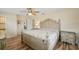 Spacious main bedroom with wood floors, and ensuite bathroom entrance at 14564 110Th Ter, Largo, FL 33774
