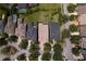 Overhead aerial showing a well-maintained neighborhood street and the rooftops of several homes with manicured lawns at 14610 Mondavi Ct, Tampa, FL 33626