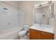Bathroom featuring a shower-tub combo and a marble vanity at 14610 Mondavi Ct, Tampa, FL 33626