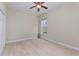Bedroom featuring a ceiling fan, tile floors, and a large window at 14610 Mondavi Ct, Tampa, FL 33626