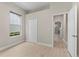 Bedroom featuring a window, closet, and hallway access at 14610 Mondavi Ct, Tampa, FL 33626