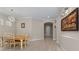 Inviting dining area with modern lighting and views of the front entryway at 14610 Mondavi Ct, Tampa, FL 33626