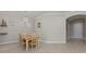 Inviting dining area with modern lighting and views of the front entryway at 14610 Mondavi Ct, Tampa, FL 33626