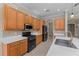 Well-equipped kitchen featuring stainless steel appliances, a gas range, and plenty of counter space at 14610 Mondavi Ct, Tampa, FL 33626