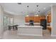 Bright kitchen with an island, pendant lighting, stainless steel appliances, and a breakfast nook at 14610 Mondavi Ct, Tampa, FL 33626