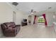 Spacious living room with tiled floors and sliding glass doors at 14610 Mondavi Ct, Tampa, FL 33626