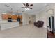 Bright, open living space with tile flooring and modern kitchen with island at 14610 Mondavi Ct, Tampa, FL 33626