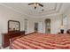 Comfortable main bedroom with large windows and tray ceiling at 14610 Mondavi Ct, Tampa, FL 33626