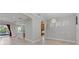 Bright open concept living and dining area with seamless access to backyard pool at 14610 Mondavi Ct, Tampa, FL 33626