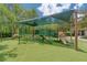 Vibrant playground shaded with canopy, featuring slides, climbing structures and soft turf for safe play at 14610 Mondavi Ct, Tampa, FL 33626