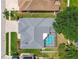 Aerial view showcasing the house with a pool and the surrounding neighborhood at 1521 Brittany Ct, New Port Richey, FL 34655