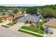 Aerial view of a home with a spacious yard, screened-in pool, and inviting curb appeal at 1521 Brittany Ct, New Port Richey, FL 34655