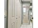 Neutral bathroom with tiled floors, glass shower, and closet at 1521 Brittany Ct, New Port Richey, FL 34655
