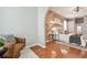 Bedroom features a brick accent wall and comfortable chair with a view of the bed at 1521 Brittany Ct, New Port Richey, FL 34655