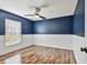 Cozy bedroom with wainscoting and plenty of natural light at 1521 Brittany Ct, New Port Richey, FL 34655