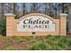 Entrance sign for Chelsea Place with manicured landscaping at 1521 Brittany Ct, New Port Richey, FL 34655