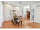 Dining room with wooden floors, table with seating for six, and an elegant chandelier at 1521 Brittany Ct, New Port Richey, FL 34655