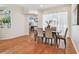Dining room features hardwood floors, archways, and views into adjacent living spaces at 1521 Brittany Ct, New Port Richey, FL 34655