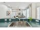 Stylish kitchen sink with views into the living room at 1521 Brittany Ct, New Port Richey, FL 34655