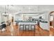 Bright, open kitchen featuring barstool seating, modern appliances, ample counter space, and seamless flow to dining area at 1521 Brittany Ct, New Port Richey, FL 34655