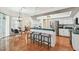 Bright kitchen offers bar stool seating, modern appliances, ample counter space and seamless flow into other rooms at 1521 Brittany Ct, New Port Richey, FL 34655