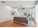 Bright living room with hardwood floors, ceiling fan and neutral decor at 1521 Brittany Ct, New Port Richey, FL 34655
