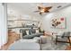 Bright living room featuring wood floors, neutral furniture, and an open concept design at 1521 Brittany Ct, New Port Richey, FL 34655