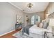 Comfortable main bedroom with exposed brick wall, ceiling fan, and ensuite at 1521 Brittany Ct, New Port Richey, FL 34655