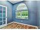 Bright office with a large arched window with views of the front yard at 1521 Brittany Ct, New Port Richey, FL 34655