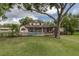 Expansive backyard features a lovely pool and patio area for outdoor enjoyment at 1834 Daiquiri Ln, Lutz, FL 33549