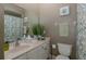 Well-lit bathroom featuring a vanity with ample counter space and modern fixtures at 1834 Daiquiri Ln, Lutz, FL 33549