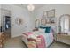 Comfortable bedroom featuring unique decor, ample natural light, and inviting ambiance at 1834 Daiquiri Ln, Lutz, FL 33549