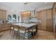 Bright kitchen featuring a large center island with seating, modern appliances, and views of the lake at 1834 Daiquiri Ln, Lutz, FL 33549