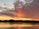 Scenic lake view at sunset with colorful, illuminated clouds at 1834 Daiquiri Ln, Lutz, FL 33549